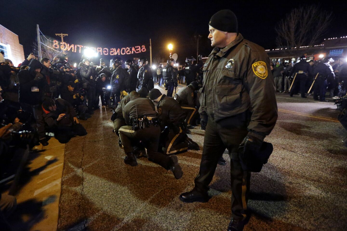 Police take people into custody in Ferguson, Mo., on Nov. 25.