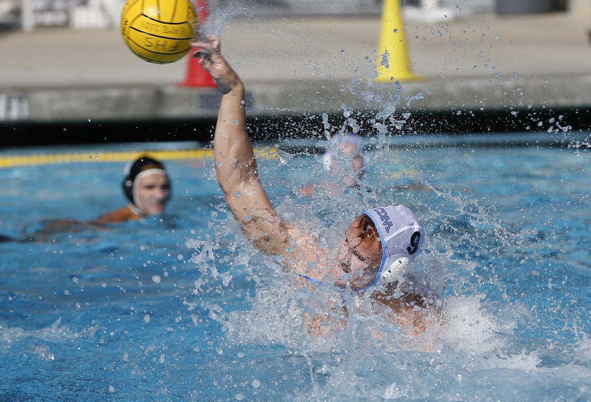 Corona del Mar's Camren Simoncelli (9) fires in an open shot for a goal against Foothill.