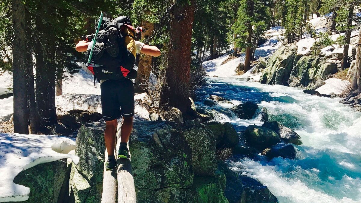 Jake Gustafson crosses Bear Creek along the Pacific Crest Trail near Kings Canyon National Park on June 16, 2017. Rangers are warning hikers to think twice about crossing swift water after more than a dozen people drowned in Sierra rivers.