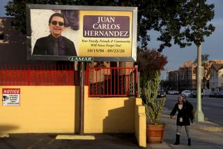 LOS ANGELES, CA - FEBRUARY 03: A billboard in memory of Juan Carlos Hernandez at the corner of Florence and Western Avenues, down the street from where he use to work at VIP Collective marijuana dispensary on Wednesday, Feb. 3, 2021 in Los Angeles, CA. Yajaira Hernandez's 21-year-old son, Juan Carlos Hernandez, went to work one afternoon in September 2020 and never came home. She looked for her son for nearly two months, until the police told her they'd found his remains in the Mojave desert, 150 miles from where he was last seen at his job at a marijuana dispensary in South Los Angeles. (Gary Coronado / Los Angeles Times)