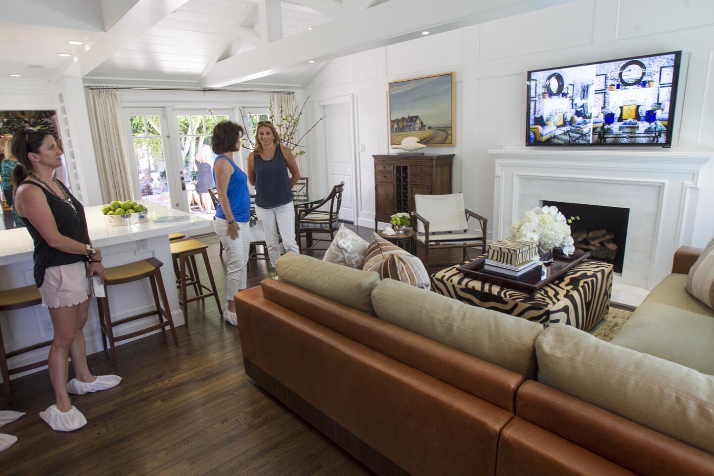 Guests tour the main living room at the Butera Residence on 700 East 15th Street on Thursday, May 15. (Scott Smeltzer - Daily Pilot)