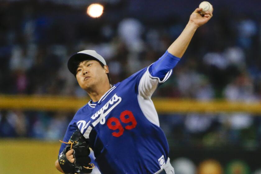 Hyun-Jin Ryu throws against the San Diego Padres during a spring training game on March 12.