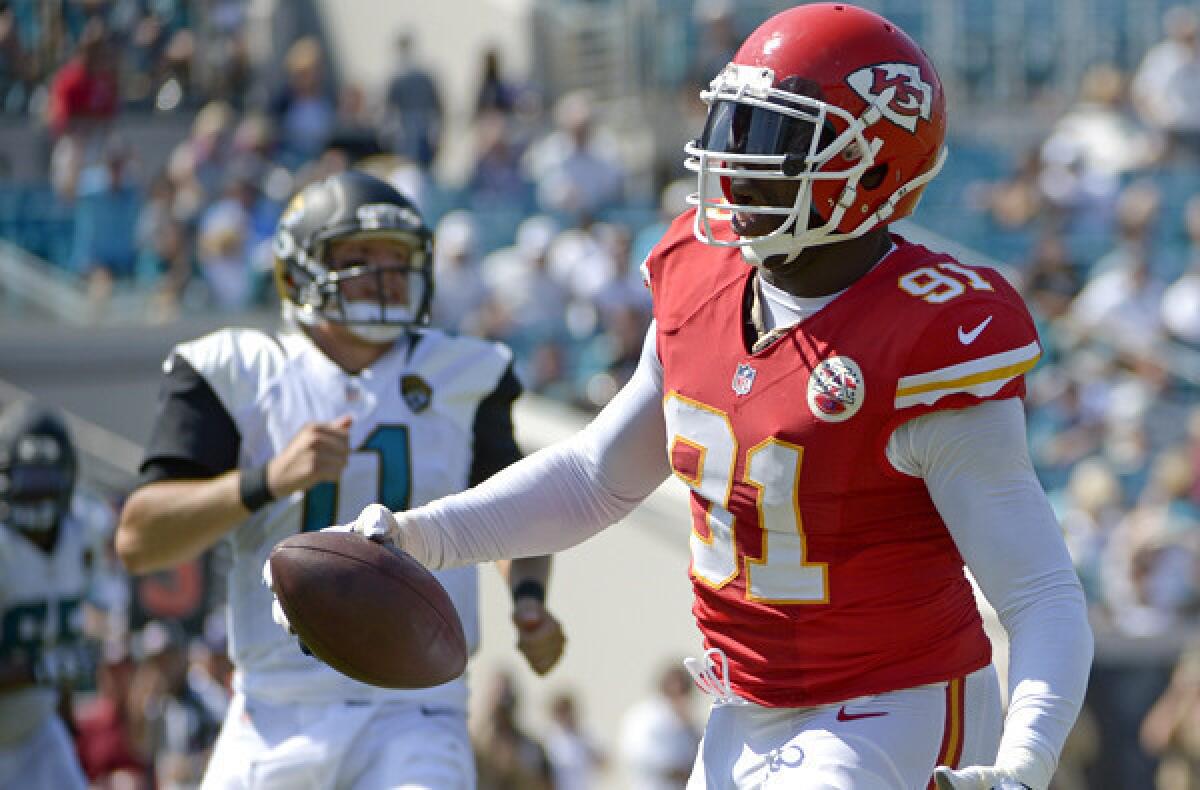 Chiefs linebacker Tamba Hali (91) runs into the end zone for a touchdown after intercepting a pass from Jaguars quarterback Blaine Gabbert (11) in the second half Sunday in Jacksonville, Fla.