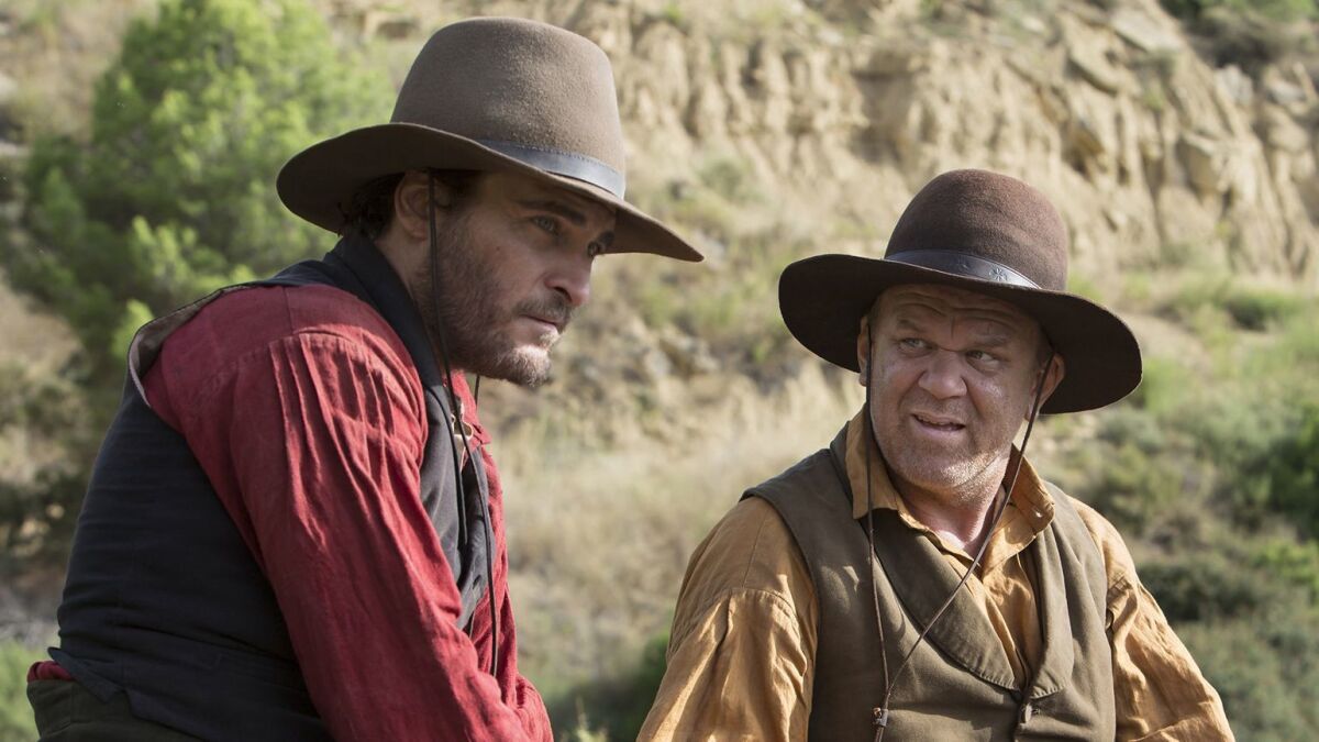 John C. Reilly, right, and Joaquin Phoenix in "The Sisters Brothers."