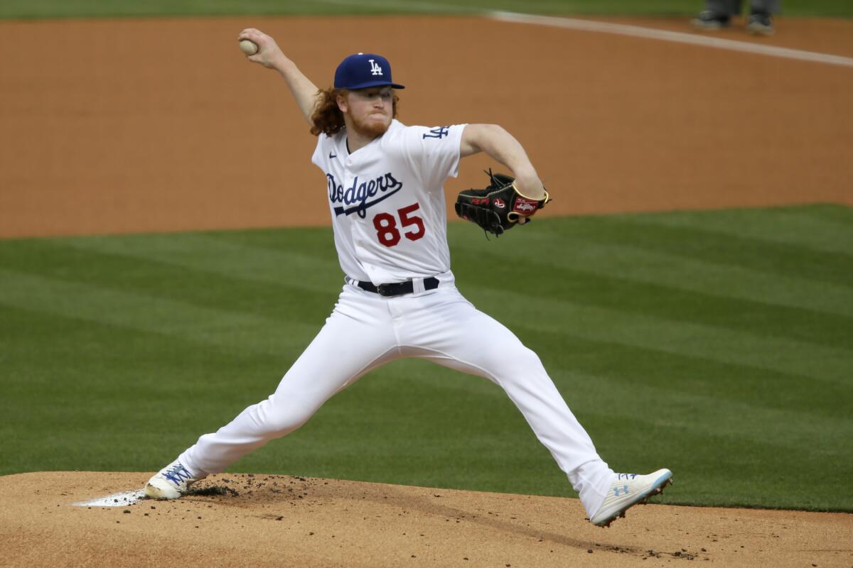 Los Angeles Dodgers starting pitcher Dustin May throws to a San Diego Padres.