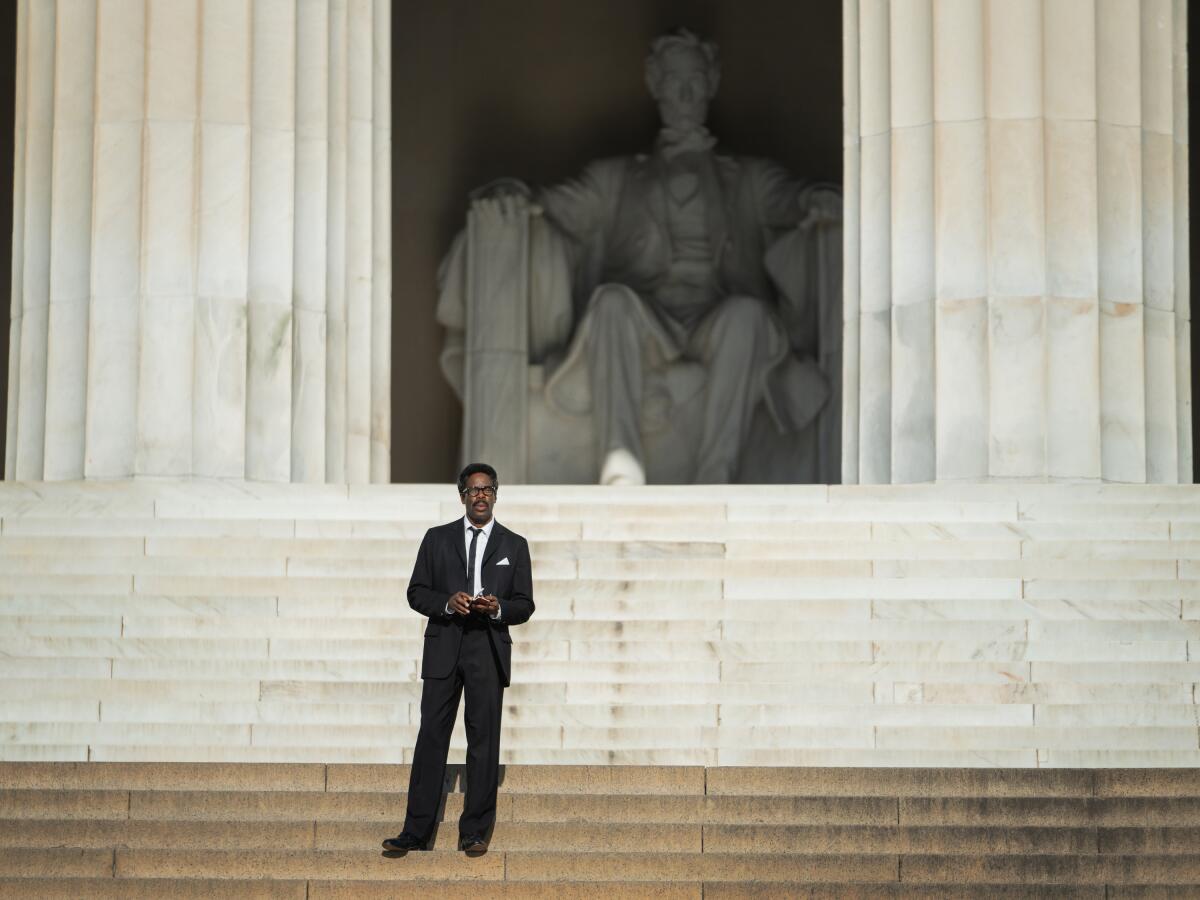 Colman Domingo stands in front of the Lincoln Memorial in a scene from the biopic "Rustin."