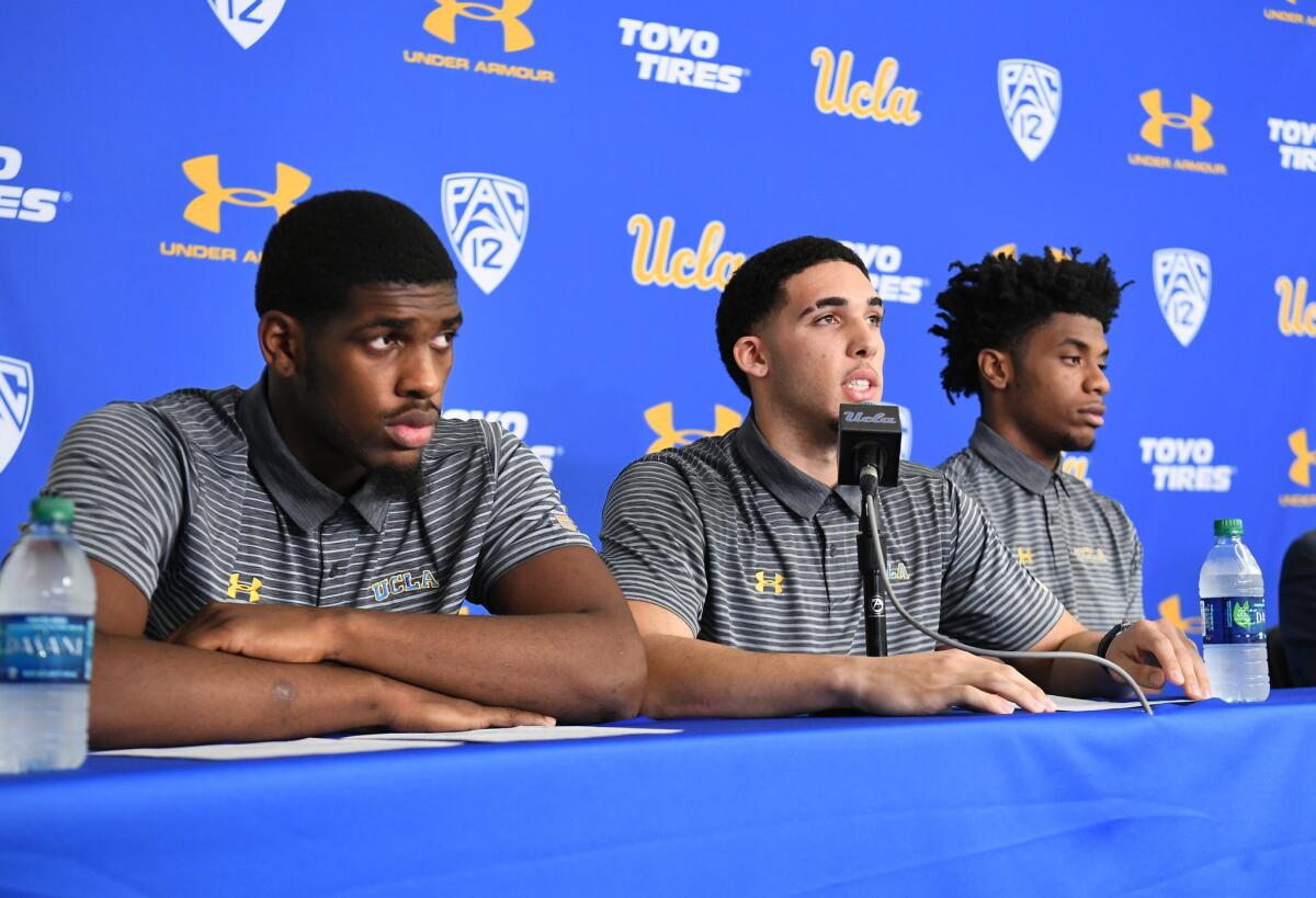 UCLA basketball players (from left) Cody Riley, LiAngelo Ball and Jalen Hill give statements at Pauley Pavilion during a news conference after they returned from China.