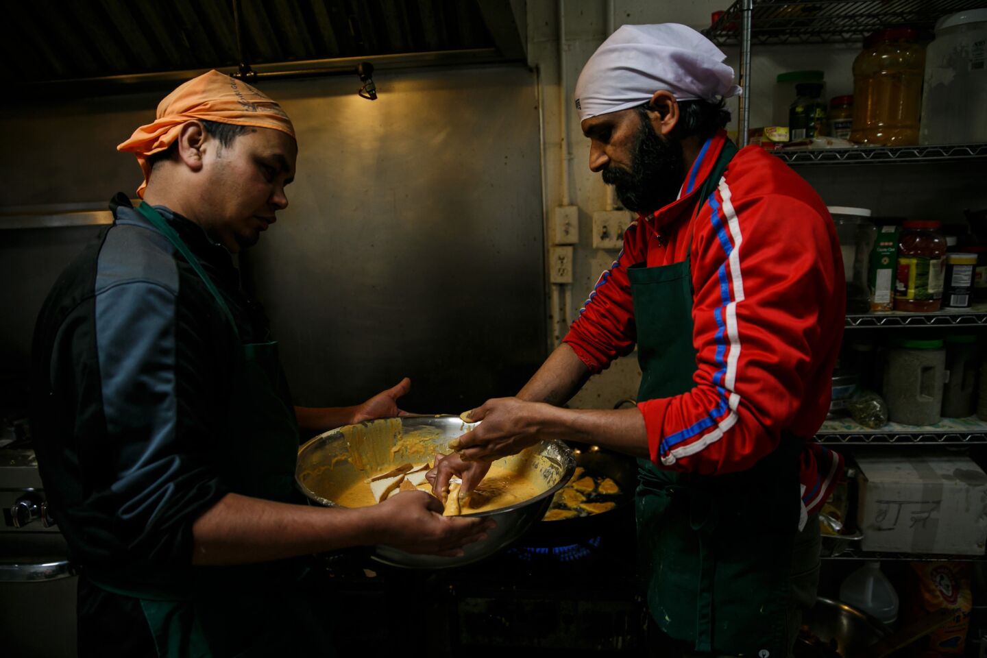 Ashok Kumar, left and Raj Kumar prepare breakfast at Shri Guru Ravidass.