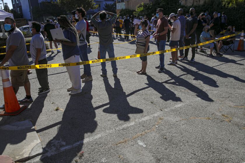 Los Angeles, CA - August 10: People wait in line to get Monkeypox virus vaccine at St.John's Well Child & Family Center on Wednesday, Aug. 10, 2022 in Los Angeles, CA. (Irfan Khan / Los Angeles Times)