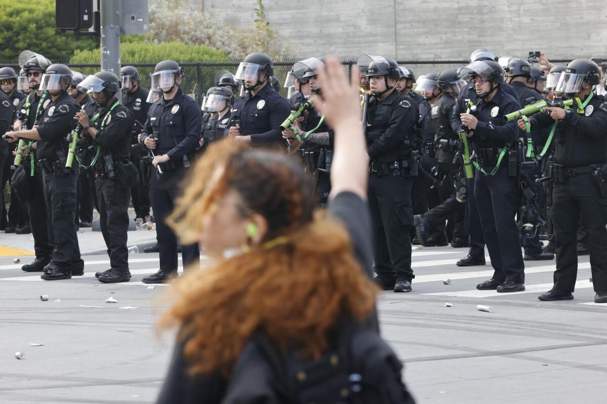 Protesters are pushed back by LAPD