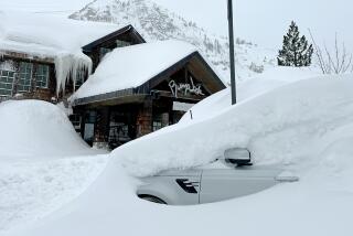 A car is buried under snow at Palisades Tahoe on Feb 27.