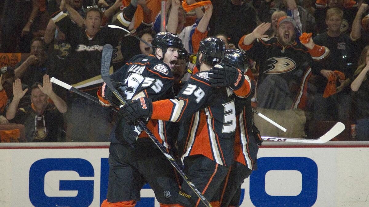 Ducks players celebrate in front of a jubilant Honda Center crowd following a first-period goal by Nick Bonino against the Kings in Game 5 of the Western Conference semifinals Monday.