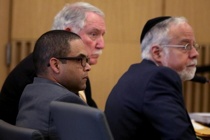  Eddie F. Gonzalez, 51, center, with lead attorney Michael Schwartz, right, and investigator Robert Dean, left, 