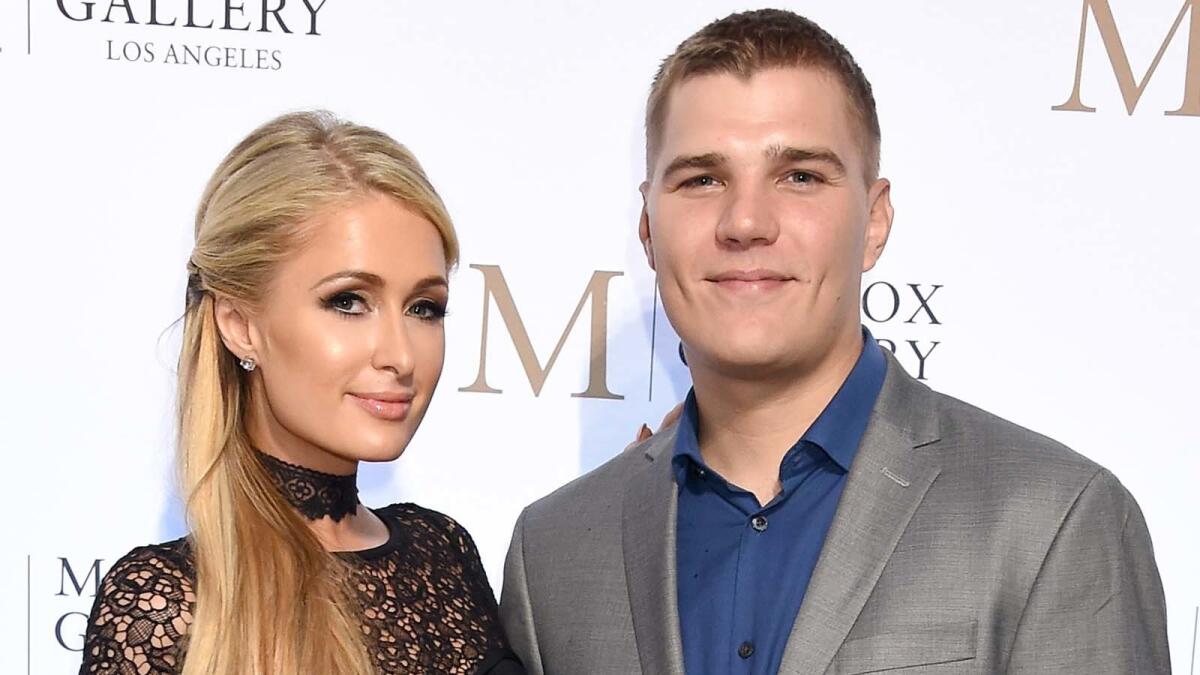 Paris Hilton and Chris Zylka at an L.A. gallery opening on Oct. 11.