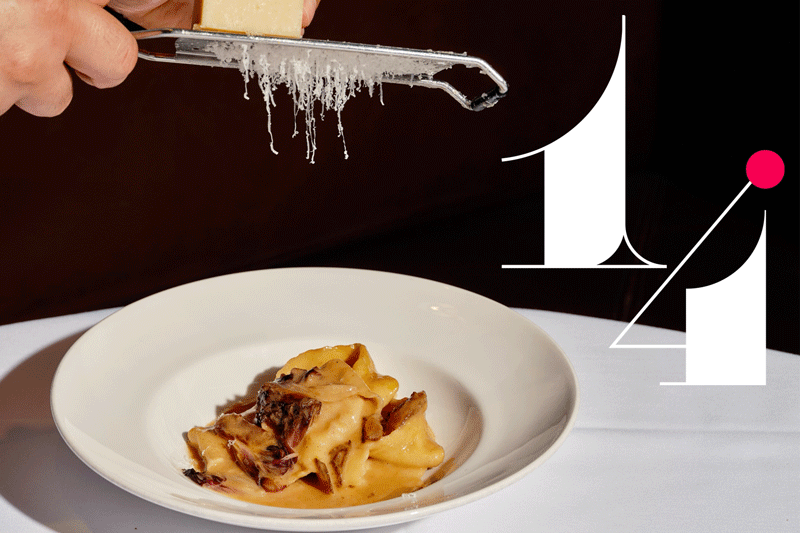 #14: Cheese grated over a plate of pasta