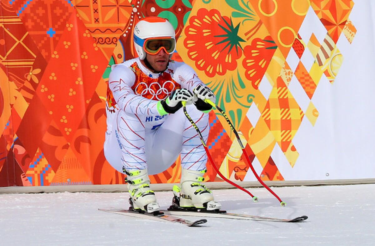 U.S. skier Bode Miller waits for his score after his downhill run at the Sochi Olympics on Sunday at Rosa Khutor Alpine Center.