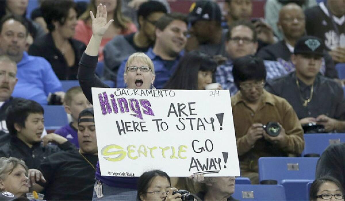 A Sacramento Kings fan show her support to keep the team in Sacramento during an NBA basketball game against the Houston Rockets on April 3, 2013.