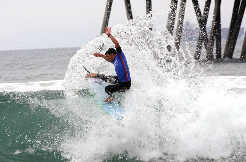 Griffin Colapinto gets some spray while doing a cutback during the final heat of the U.S. Open of Surfing.