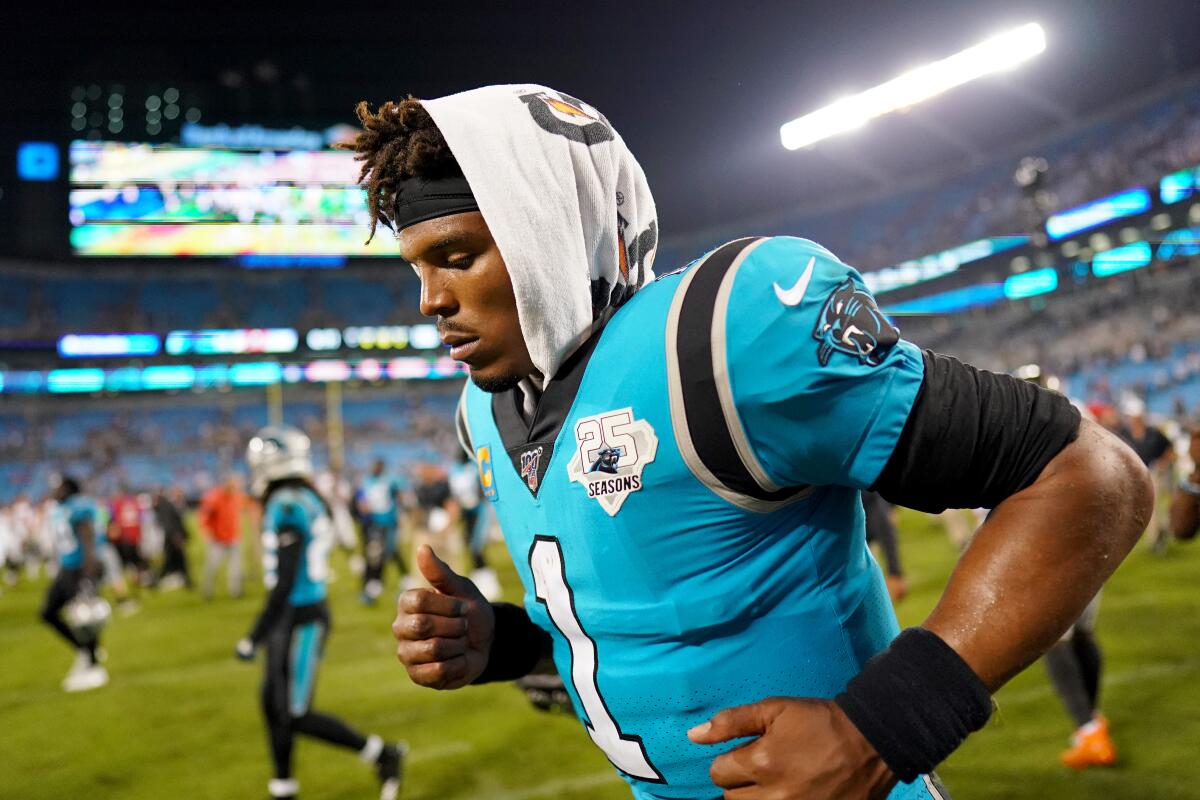 Carolina Panthers quarterback Cam Newton leaves the field following a 20-14 loss to the Tampa Bay Buccaneers on Thursday in Charlotte, N.C.