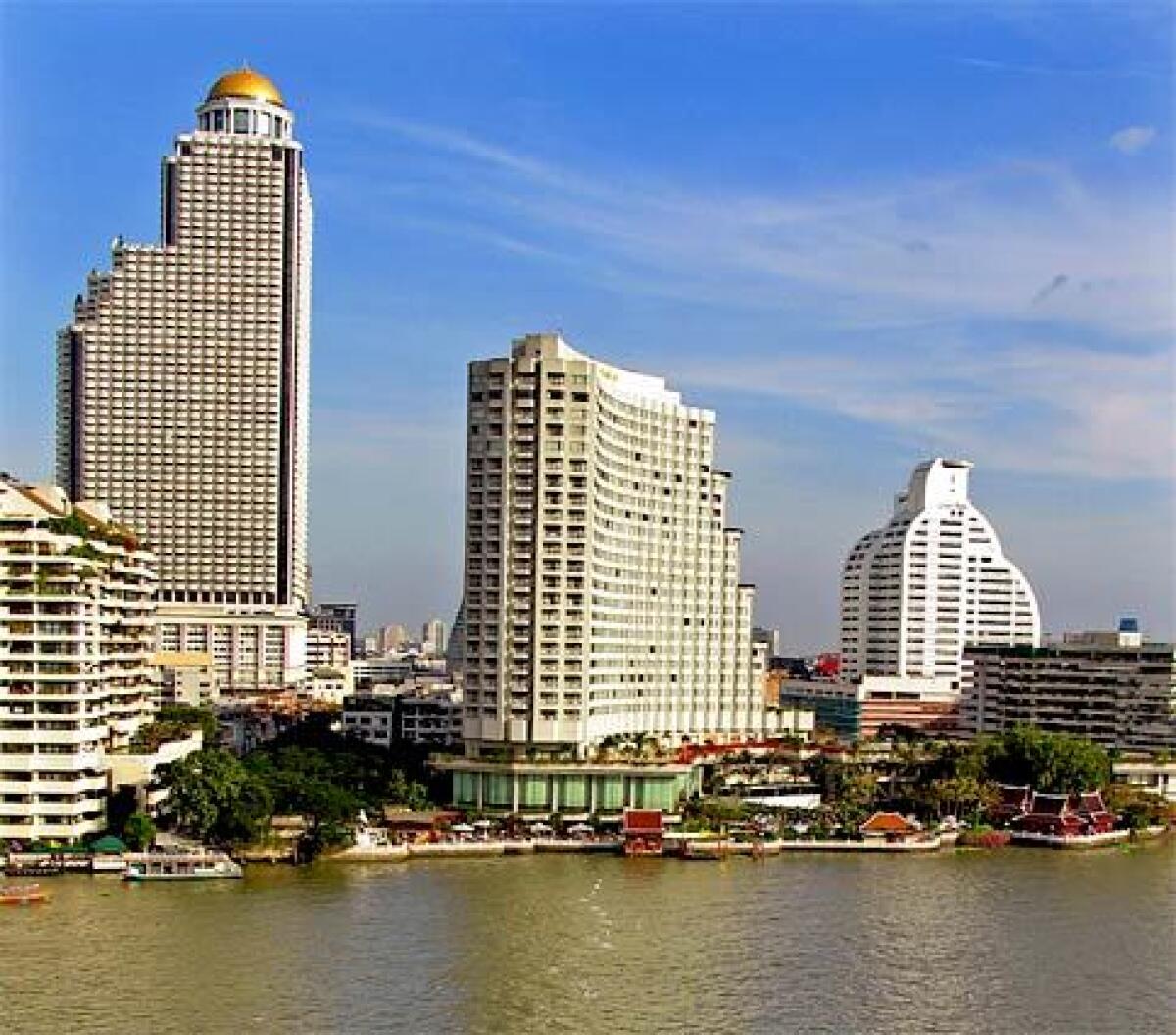 Bangkok's Shangri-La Hotel, center, has staked out not only a place on the east bank of the Chao Phraya River but a position on the Thai city's list of five-star hotels. And the Shangri-La and its Bangkok peers provide their hospitality at gratifyingly modest rates. In the Shangri-La's case, that means doubles as low as $200.