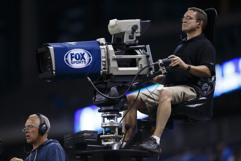 Toby Byrne was responsible for ad sales for the broadcast network, cable channels and Fox Sports. A Fox Sports camera crew films an NFL game in Detroit.
