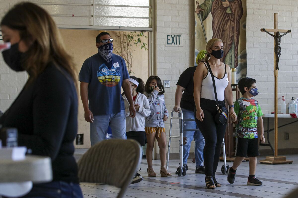 People arrive at a COVID-19 vaccination clinic at St. Patrick's Catholic Church in L.A.