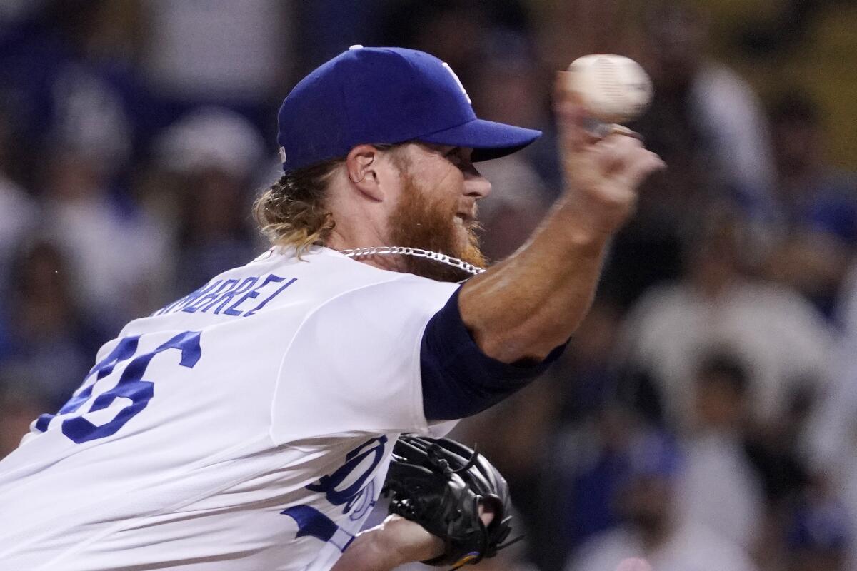 Dodgers relief pitcher Craig Kimbrel delivers during the ninth inning of a 9-4 win over the San Diego Padres.