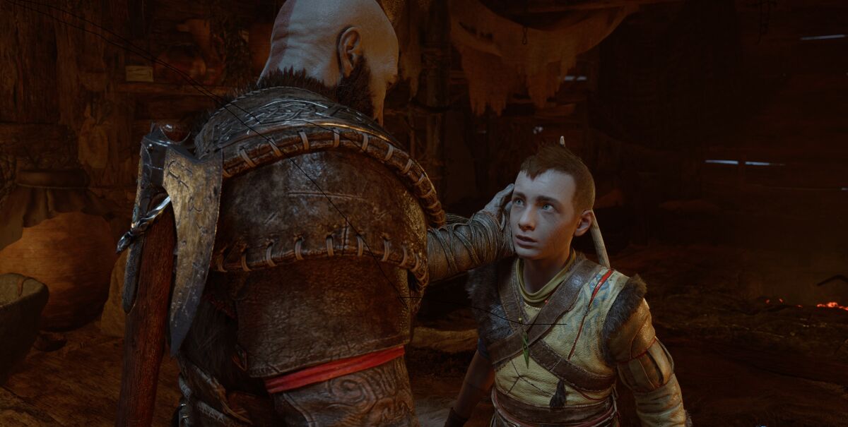 A man caresses his son's face in a videogame.