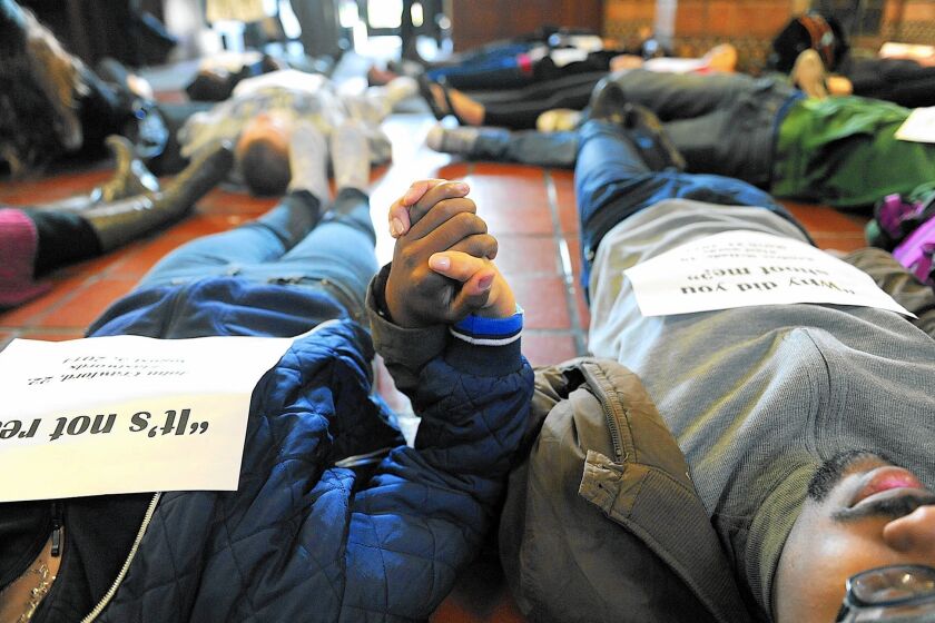 Demonstrators hold a “die-in” in December at UCLA’s Powell Library to protest police killings of blacks.