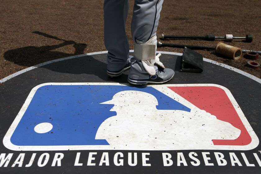 Cleveland Indians second baseman Jason Kipnis stands on the Major League Baseball logo that serves as the on deck circle 