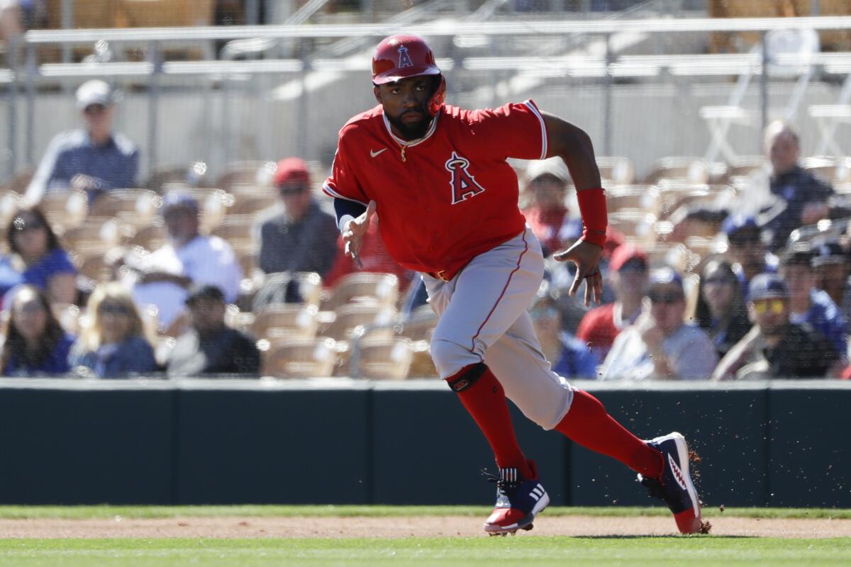 Angels outfielder Jo Adell runs towards second base.