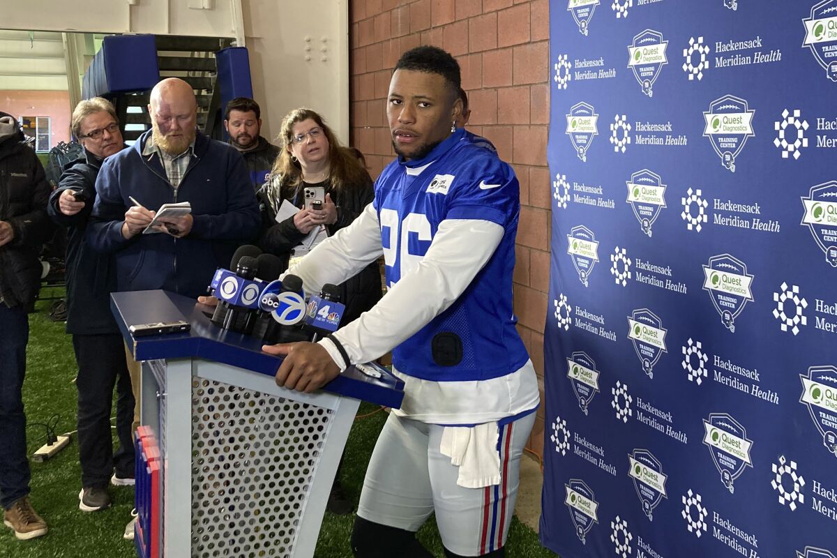 New York Giants NFL football player Saquon Barkley speaks to the media in East Rutherford, N.J., Wednesday, April 20, 2022. (AP Photo/Tom Canavan)