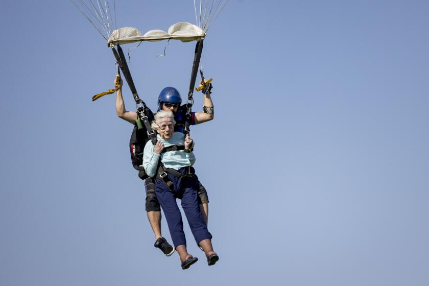 Dorothy Hoffner, 104, becomes the oldest person in the world to skydive with tandem jumper Derek Baxter on Sunday, Oct. 1, 2023, at Skydive Chicago in Ottawa, Ill. (Brian Cassella/Chicago Tribune via AP)