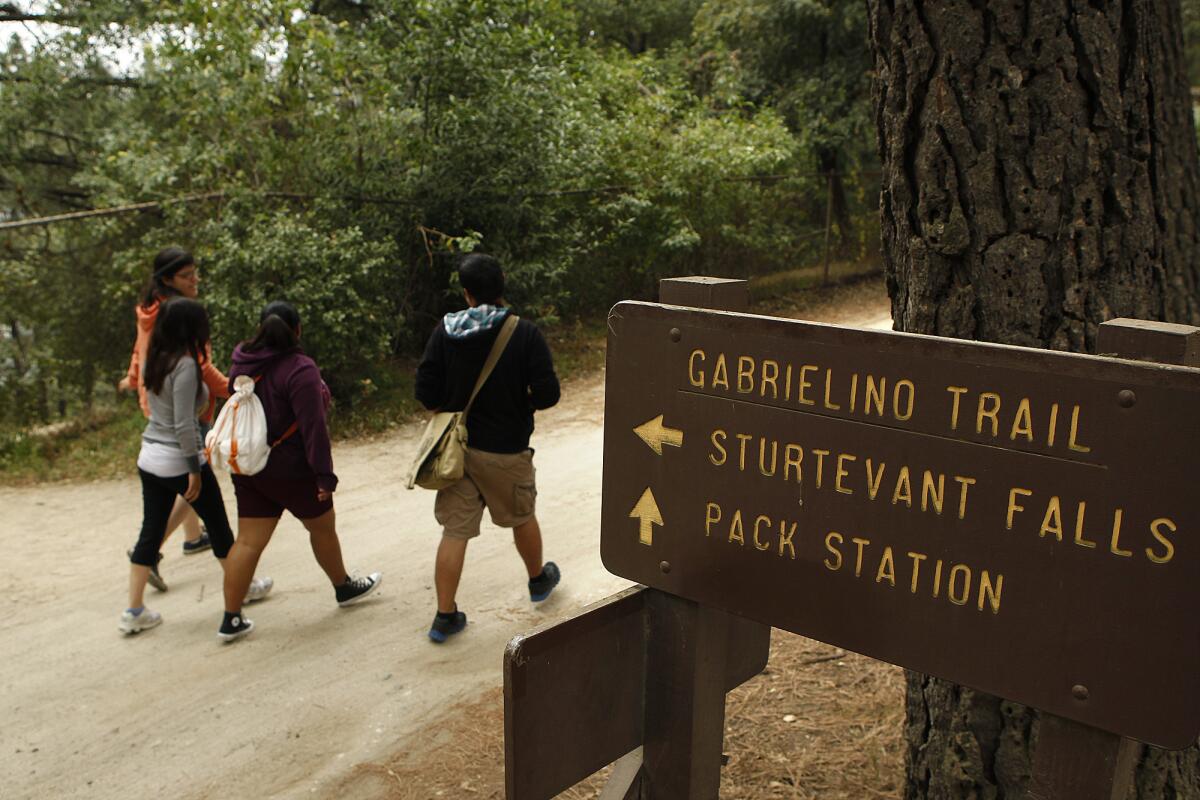 Hikers head toward Adams' Pack Station before beginning on the trail for Sturtevant Falls.