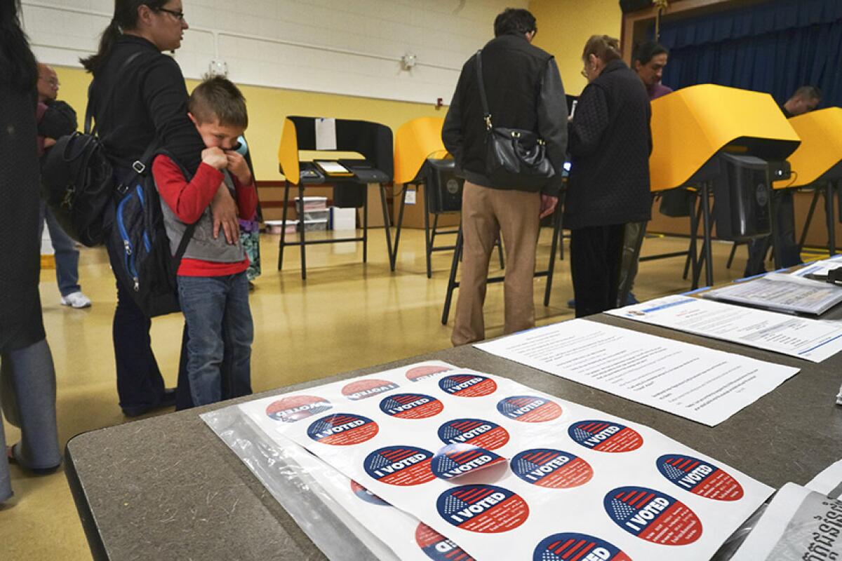 Early voters cast their ballots in Los Angeles on Monday.