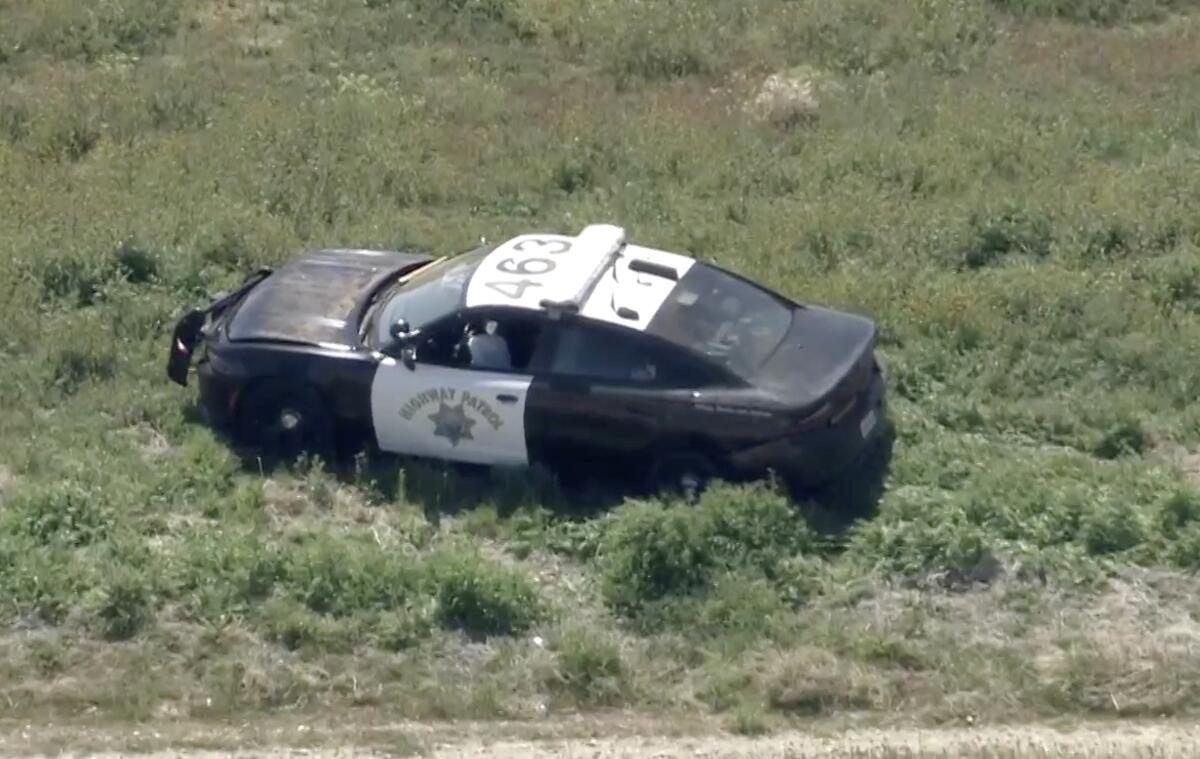 A California Highway Patrol cruiser in a field