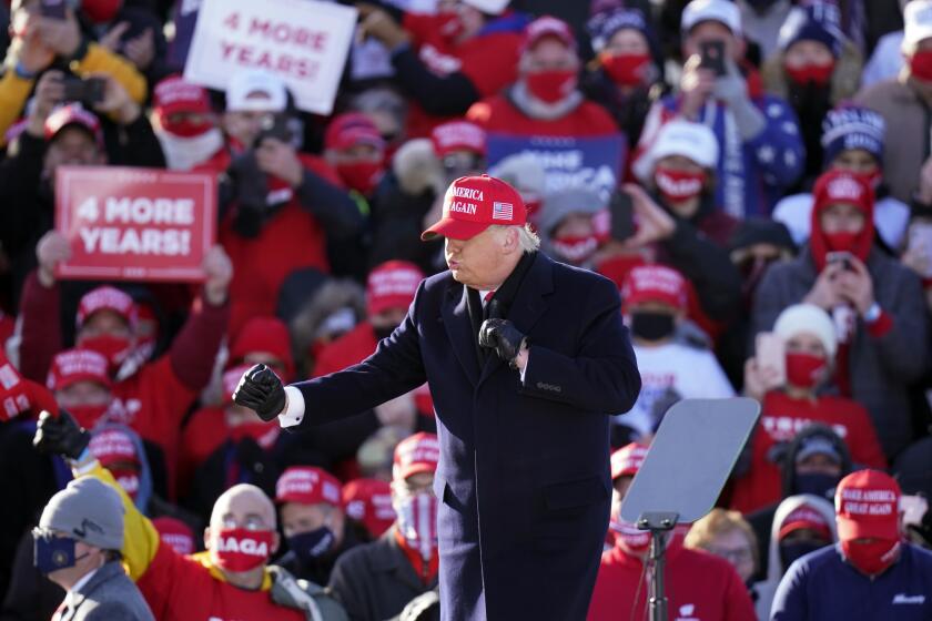 President Donald Trump dances after speaking at a campaign rally at Dubuque Regional Airport, Sunday, Nov. 1, 2020, in Dubuque, Iowa. (AP Photo/Charlie Neibergall)