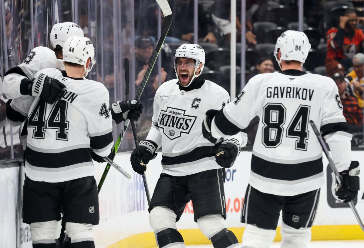 Kings forward Adrian Kempe (9) celebrates with Mikey Anderson (44), Anze Kopitar (11) and Vladislav Gavrikov.