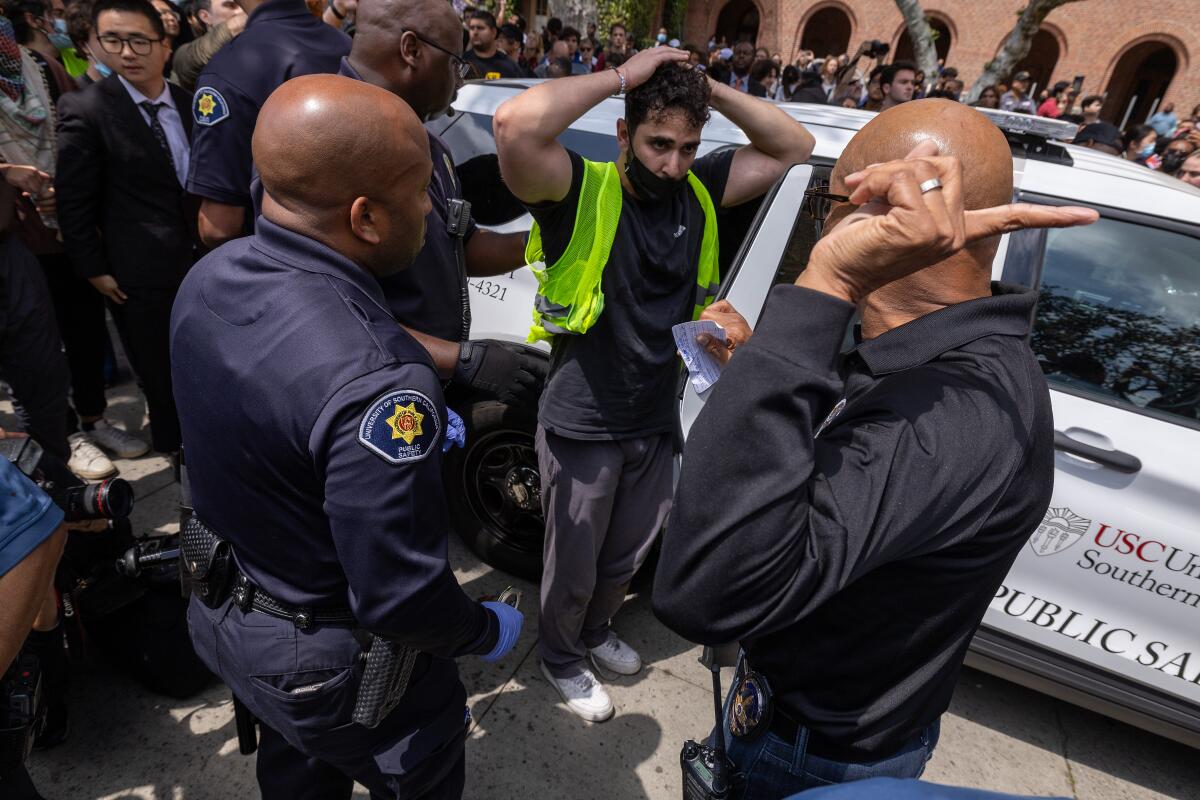 A pro-Palestinian demonstrator is released after being taken into custody at USC.