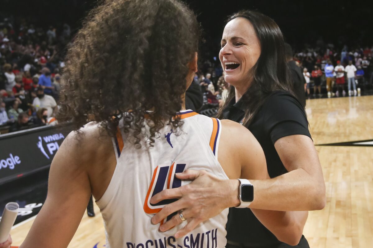 Phoenix Mercury guard Skylar Diggins-Smith (4) celebrates with coach Sandy Brondello after the Mercury defeated the Las Vegas Aces 87-84 in Game 5 of a WNBA basketball playoff series Friday, Oct. 8, 2021, in Las Vegas. (AP Photo/Chase Stevens)