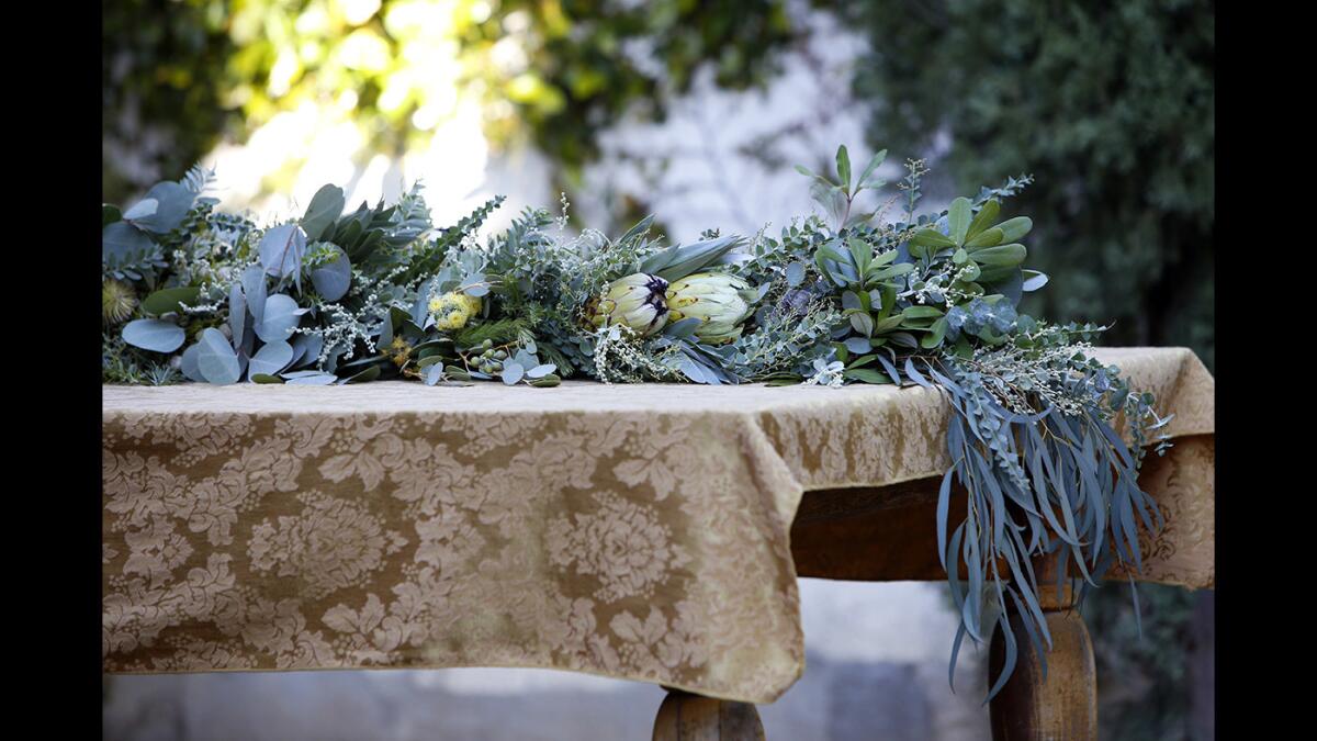 Floral designer Lori Eschler Frystak of Blossom Alliance foraged in her own Los Angeles backyard, as well as those of her neighbors, to create an elegant garland for the holidays.