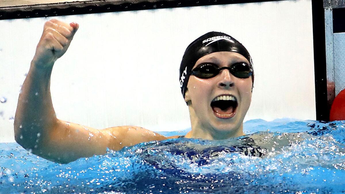 Katie Ledecky celebrates after winning the gold medal in the 400 freestyle.