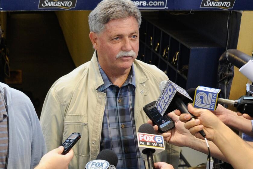 Milwaukee Brewers General Manager Doug Melvin speaks to the media before a game against the Chicago Cubs on September 27, 2014.