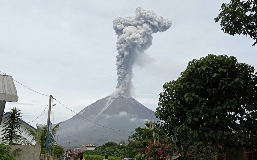 Mount Sinabung releases volcanic materials during an eruption in Karo, North Sumatra, Indonesia, Friday, May 7, 2021. Sinabung is among more than 120 active volcanoes in Indonesia, which is prone to seismic upheaval due to its location on the Pacific "Ring of Fire," an arc of volcanoes and fault lines encircling the Pacific Basin. (AP Photo/Sastrawan Ginting)