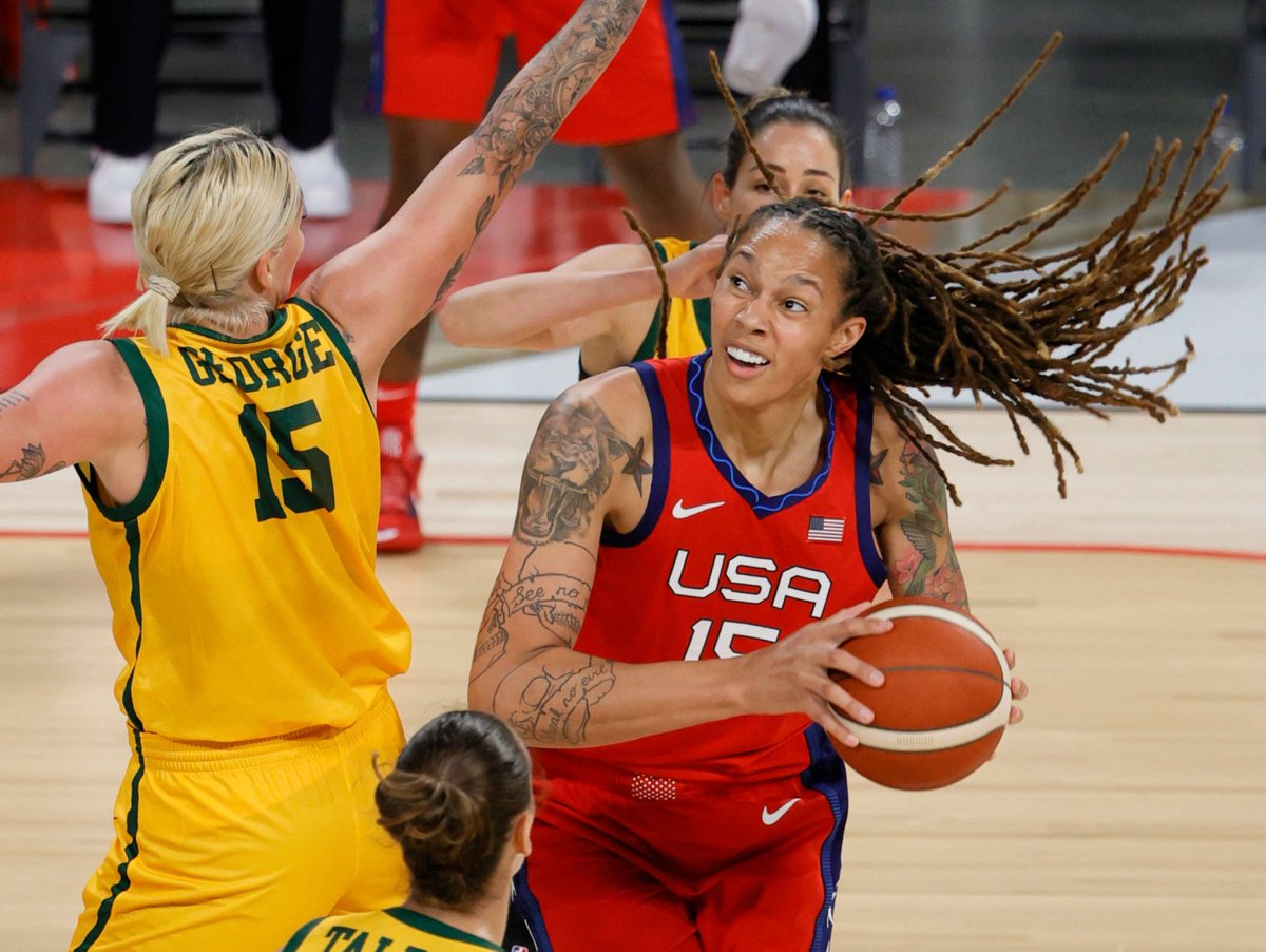 The United States' Brittney Griner looks to shoot against Australia's Cayla George during a pre-Olympic exhibition Friday.