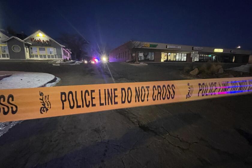 Police tape near the scene of a shooting in Colorado Springs, Colo.