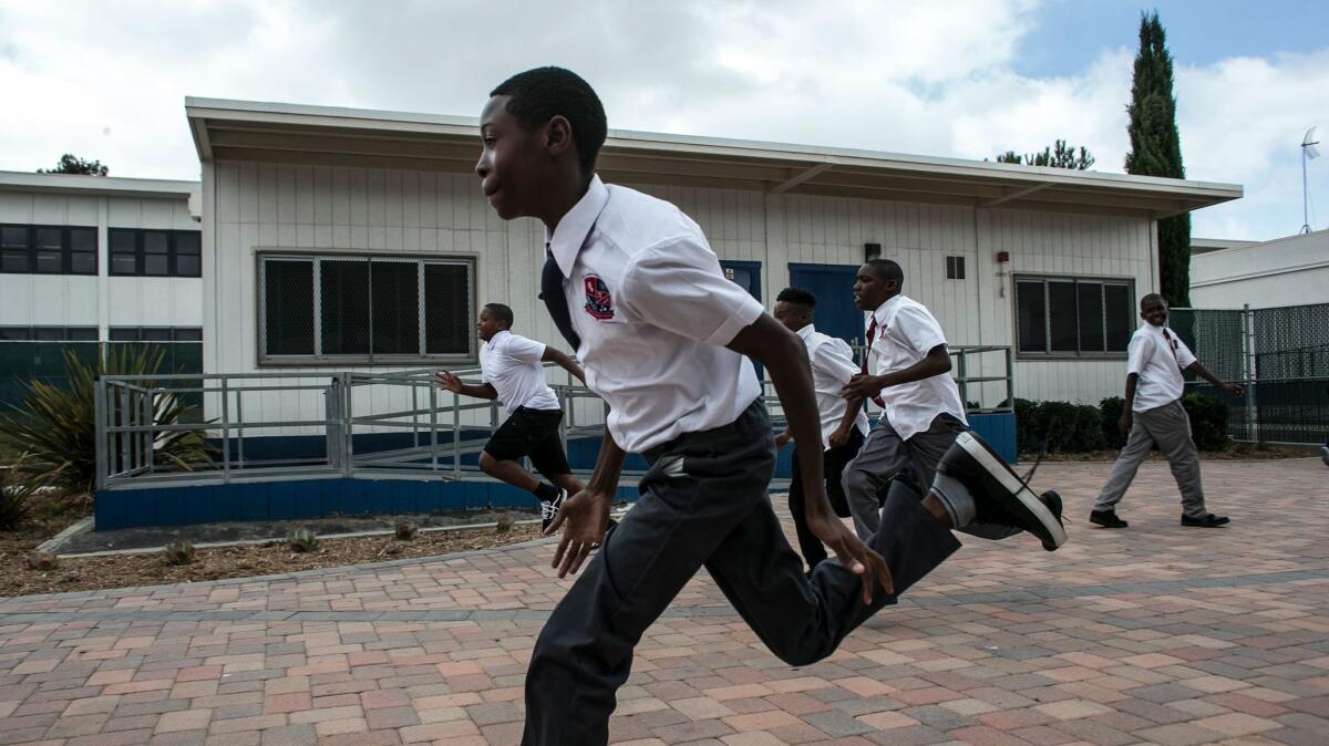 Sixth graders race each of school for the Boys Academic Leadership Academy in South L.A.
