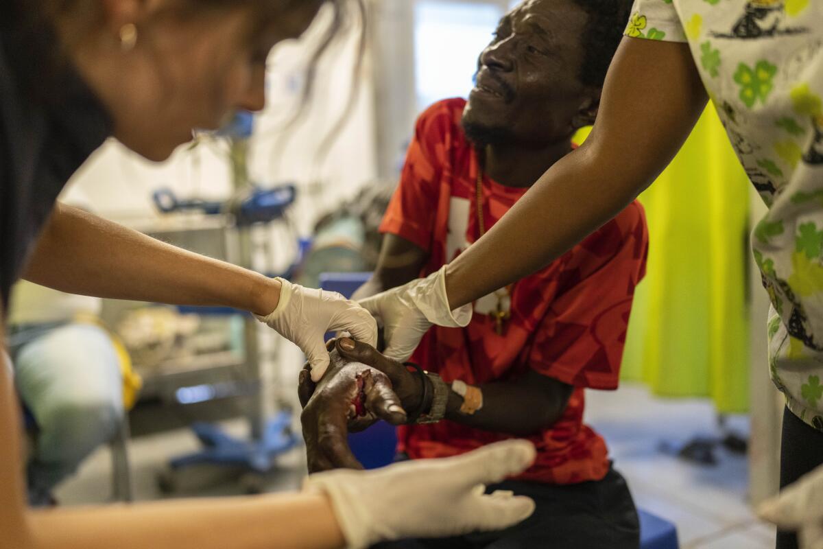 A man is treated for a bullet wound at a Doctors Without Borders hospital in Port-au-Prince, Haiti.