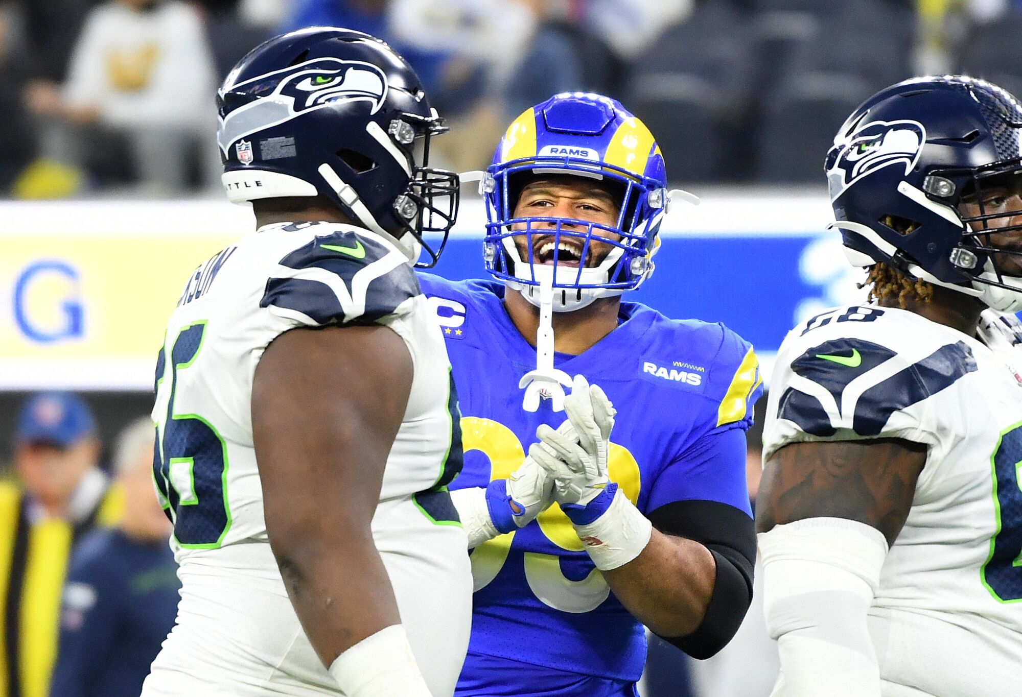 Rams defensive end Aaron Donald claps at Seattle's Gabe Jackson after the Seahawks guard was called for holding.
