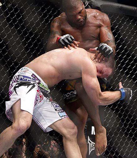 Quinton Jackson lands a knee to the head of Matt Hamill during their light-heavyweight championship bout on Saturday night at UFC 130 in Las Vegas. Jackson won the bout by unanimous decision.